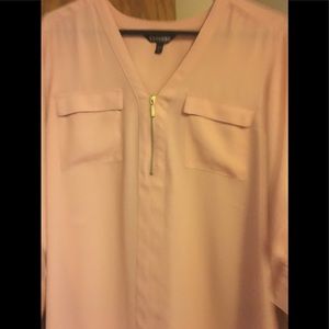 Express top in a peach color front zip and 2 pockets